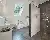 Badezimmer mit weißen und grauen Fliesen - LUXHAUS Doppelhaus Satteldach Klassik 148